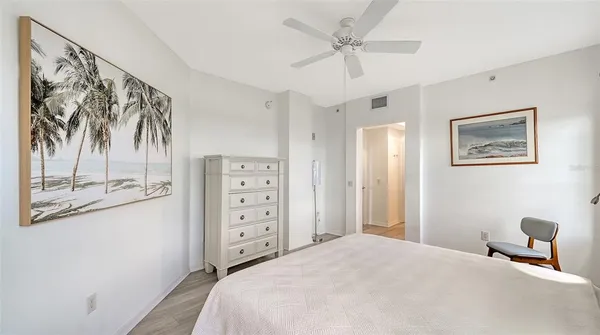 a bathroom with a granite countertop sink a toilet and a mirror