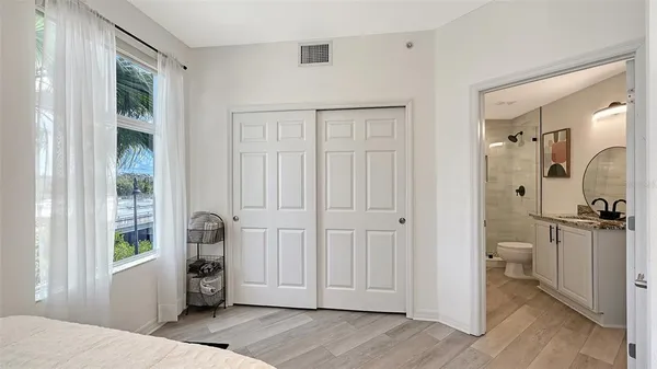 a view of a lake with houses in the back