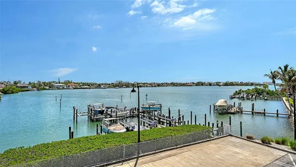 a room with furniture pool table and windows