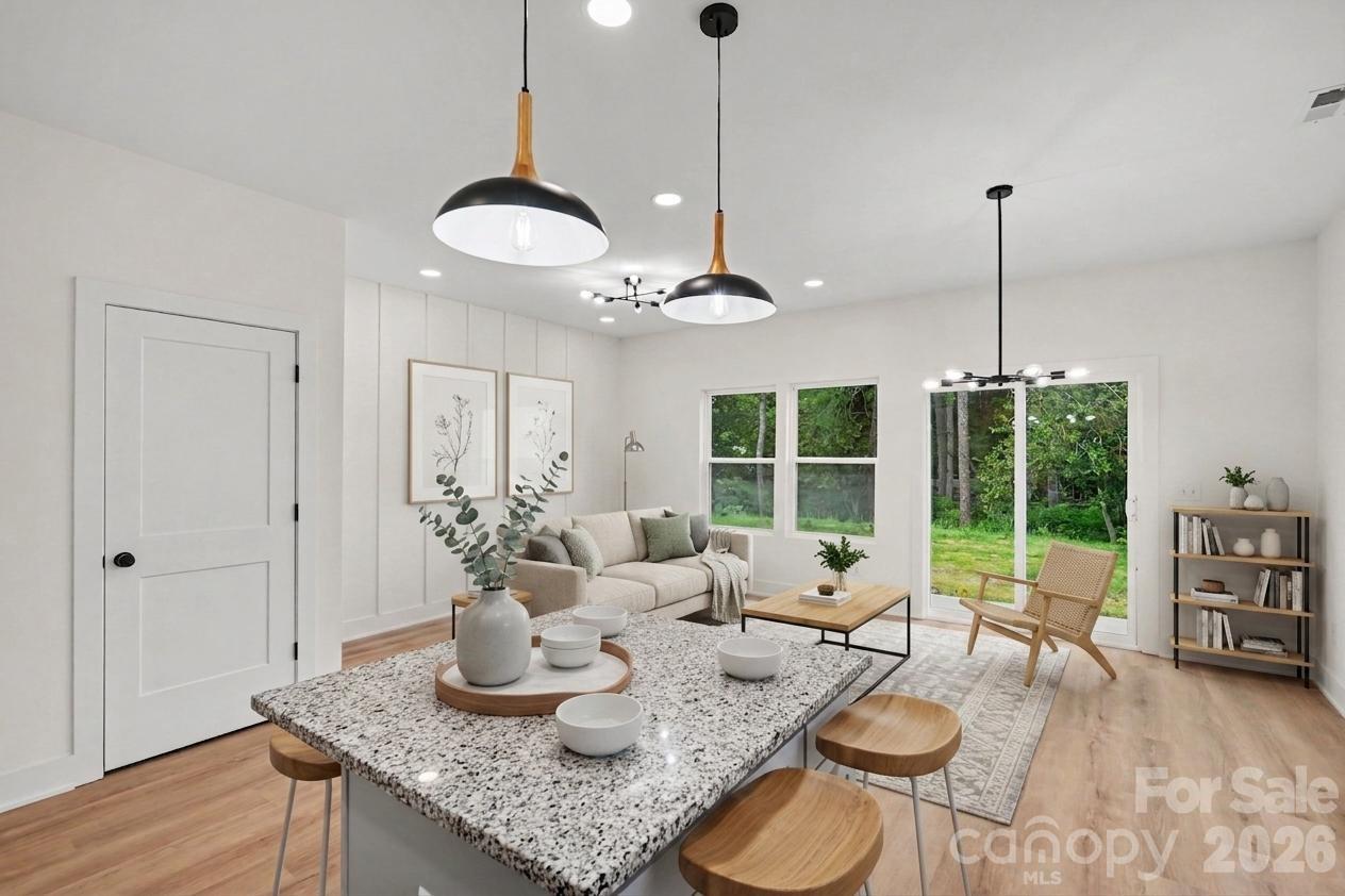 7521 Lawyers Road Charlotte, NC 28227 - Photo 5 of 35 a dining room with furniture window wooden floor
