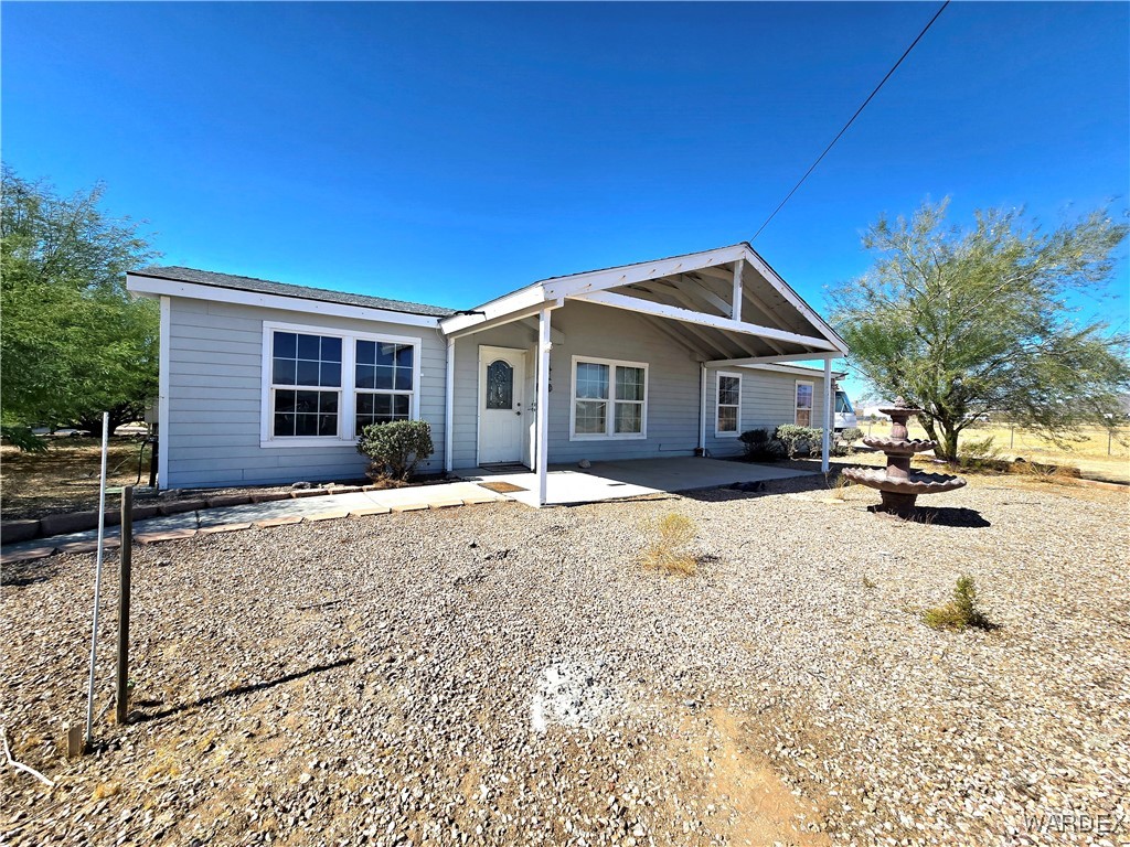 4149 Carrizo Road Golden Valley, AZ 86413 - Photo 1 of 47 a front view of a house with a yard