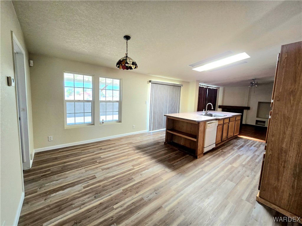 4149 Carrizo Road Golden Valley, AZ 86413 - Photo 15 of 47 a spacious bedroom with a bed and wooden floor