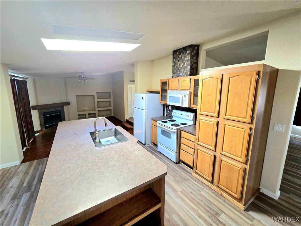 4149 Carrizo Road Golden Valley, AZ 86413 - Photo 21 of 47 a kitchen with stainless steel appliances a refrigerator and wooden floor