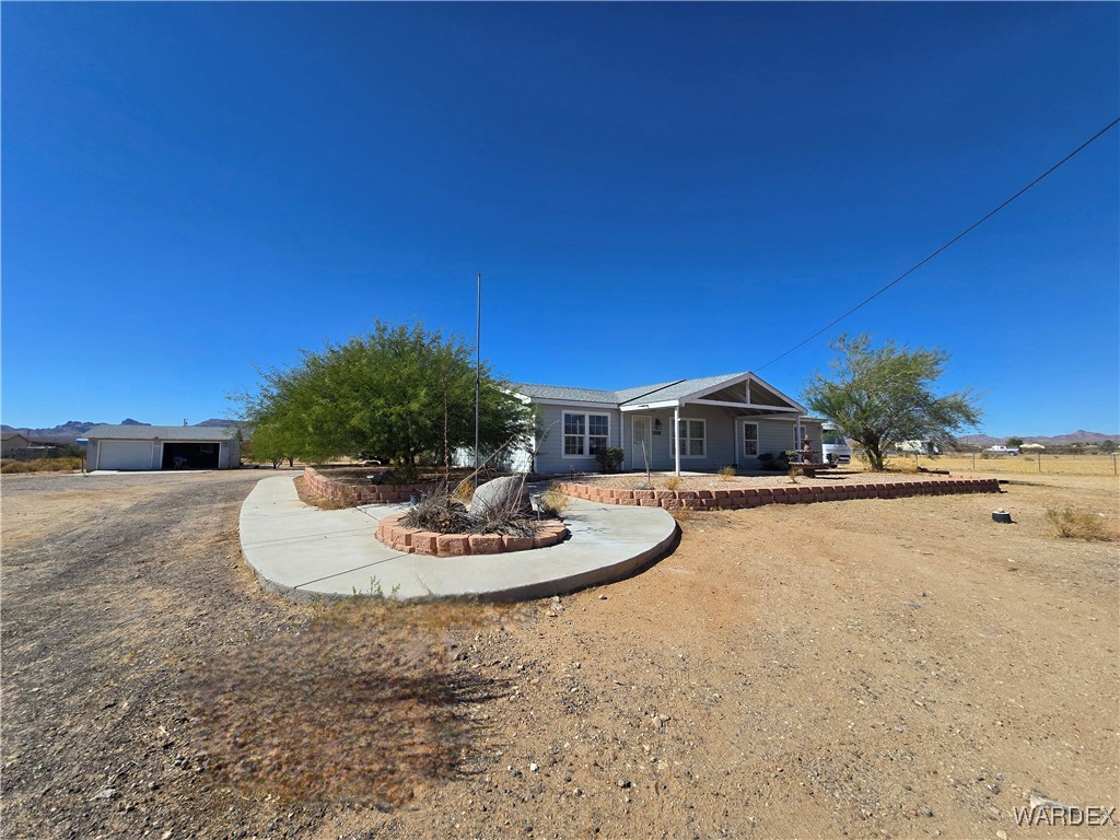 4149 Carrizo Road Golden Valley, AZ 86413 - Photo 3 of 47 a swimming pool with an outdoor seating