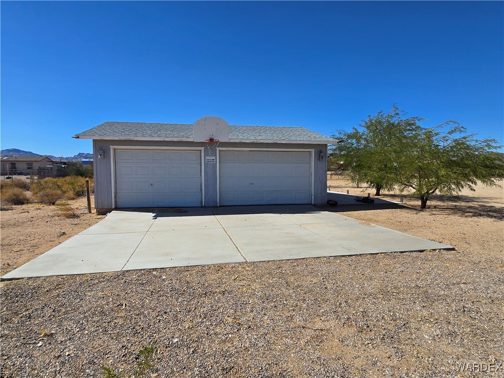 4149 Carrizo Road Golden Valley, AZ 86413 - Photo 34 of 47 a front view of a house with a yard