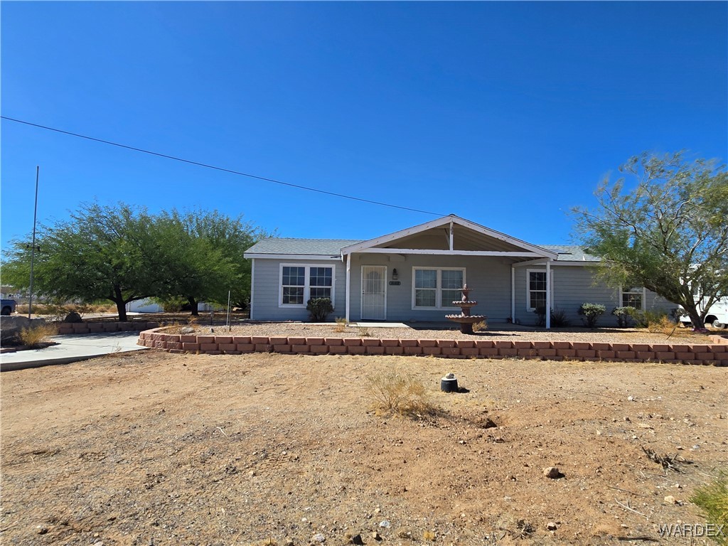 4149 Carrizo Road Golden Valley, AZ 86413 - Photo 44 of 47 a front view of a house with a yard