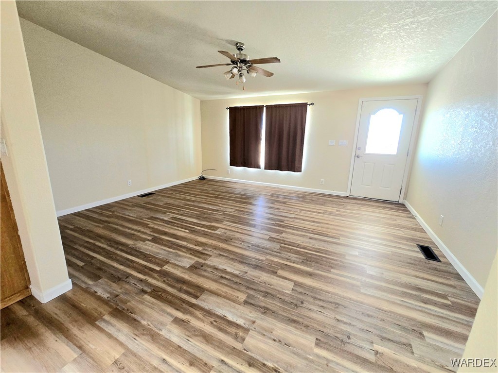 4149 Carrizo Road Golden Valley, AZ 86413 - Photo 6 of 47 a view of an empty room with a window