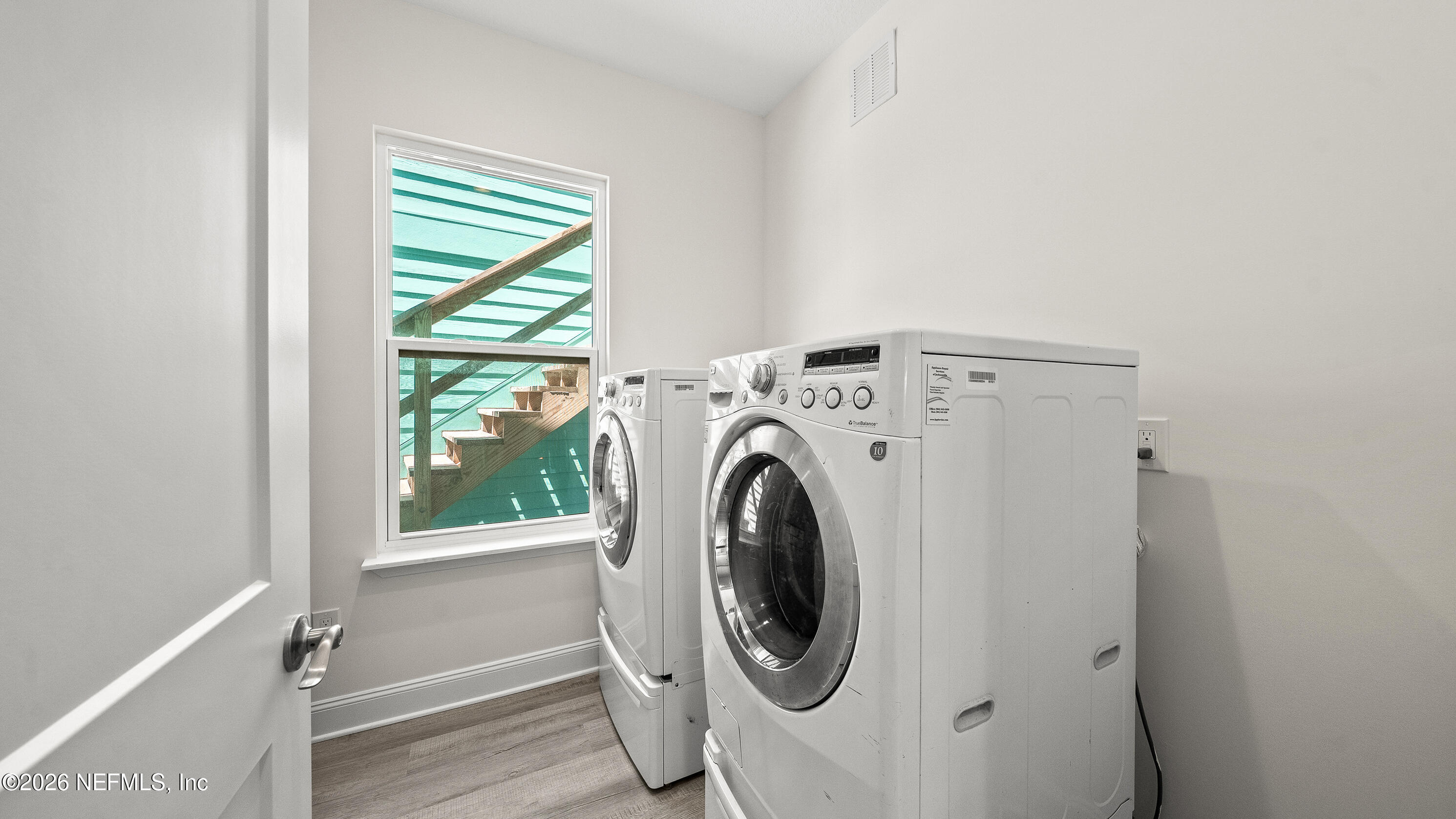 80 Seaside Capers Road St. Augustine, FL 32084 - Photo 11 of 44 a utility room with dryer and washer