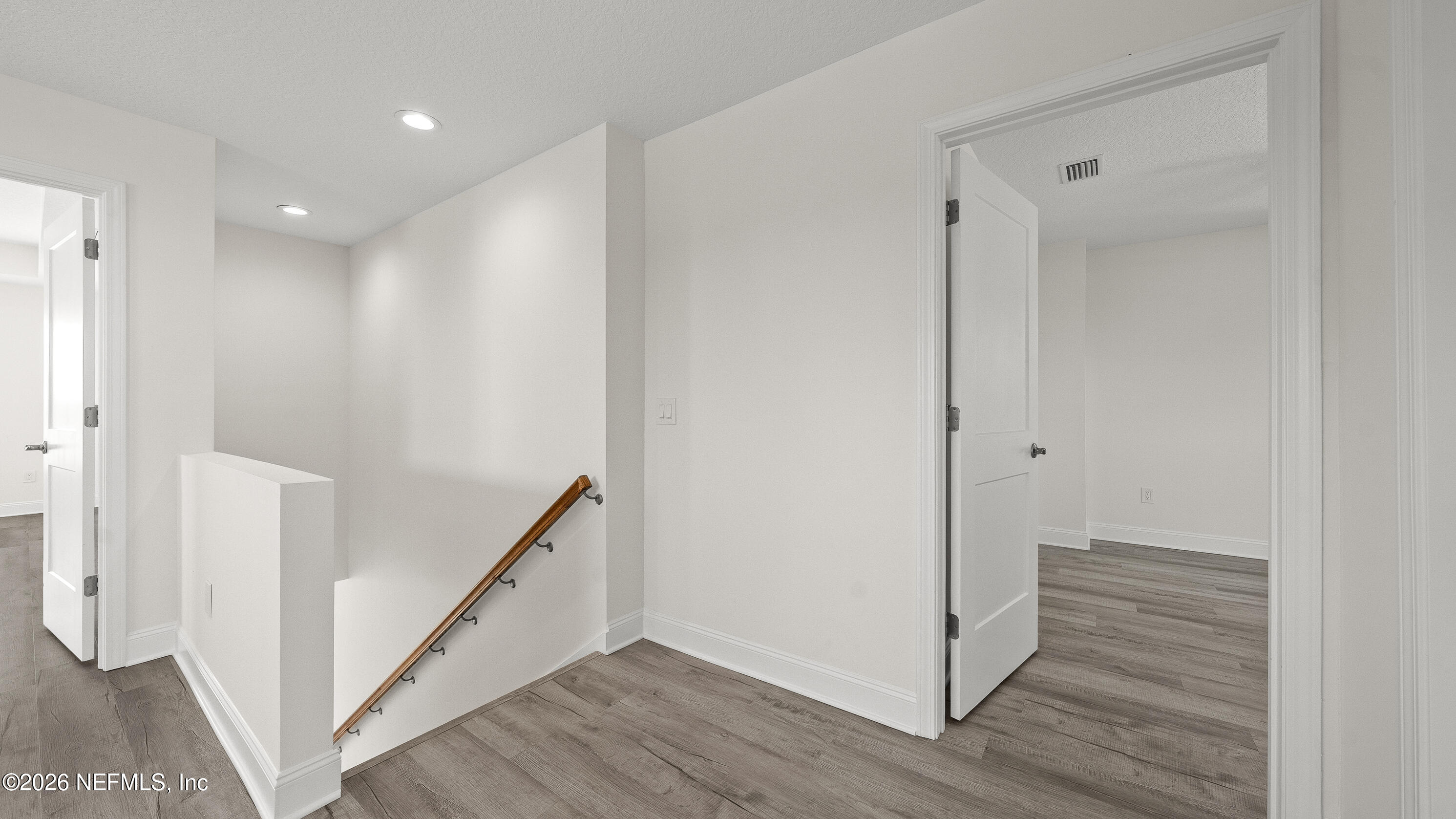 80 Seaside Capers Road St. Augustine, FL 32084 - Photo 17 of 44 a view of a hallway with wooden floor