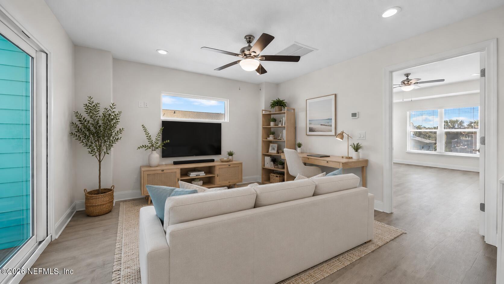 80 Seaside Capers Road St. Augustine, FL 32084 - Photo 21 of 47 a living room with furniture and a flat screen tv