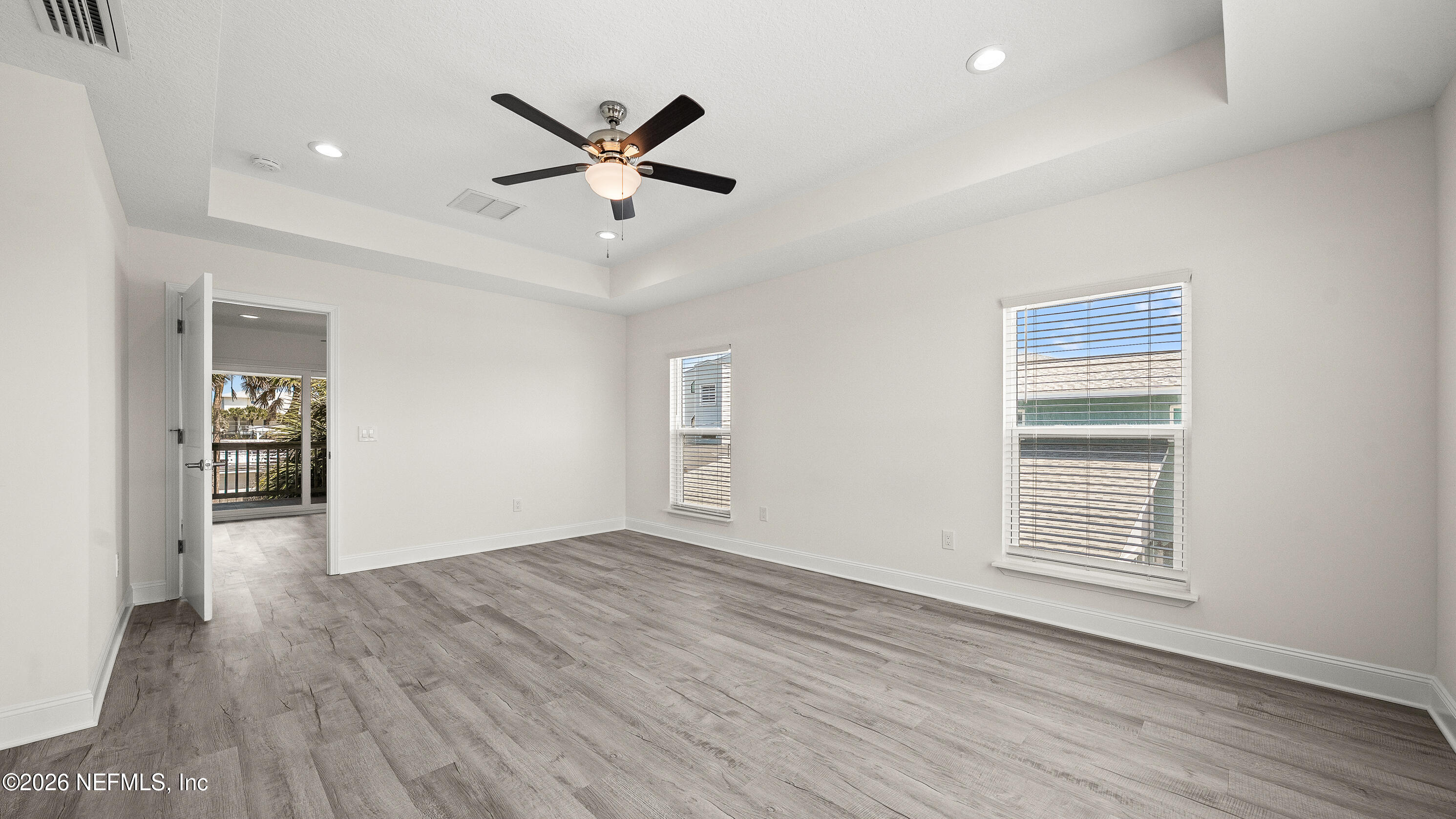 80 Seaside Capers Road St. Augustine, FL 32084 - Photo 31 of 44 an empty room with wooden floor closet and windows