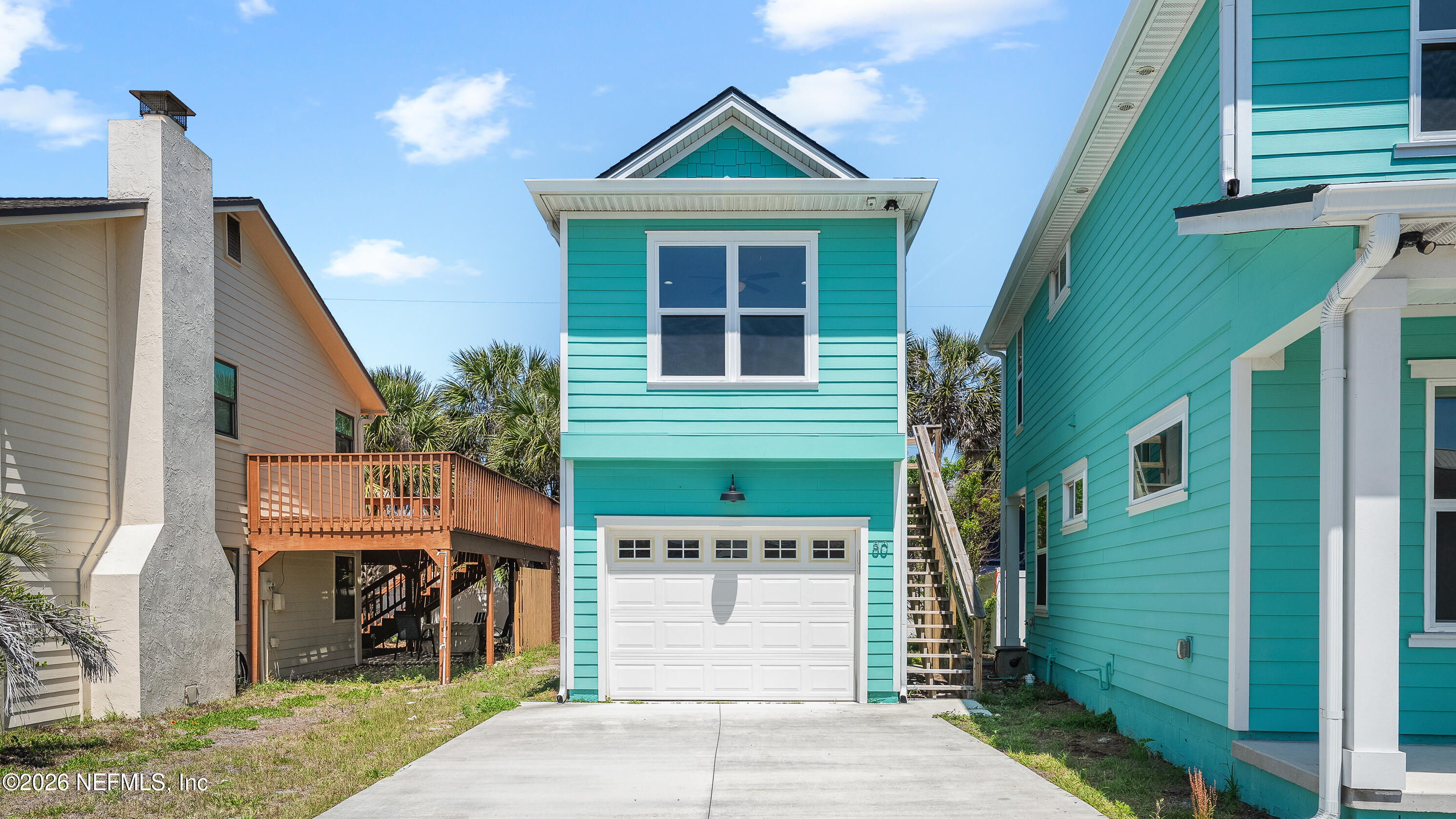 80 Seaside Capers Road St. Augustine, FL 32084 - Photo 34 of 44 a front view of a house with a yard