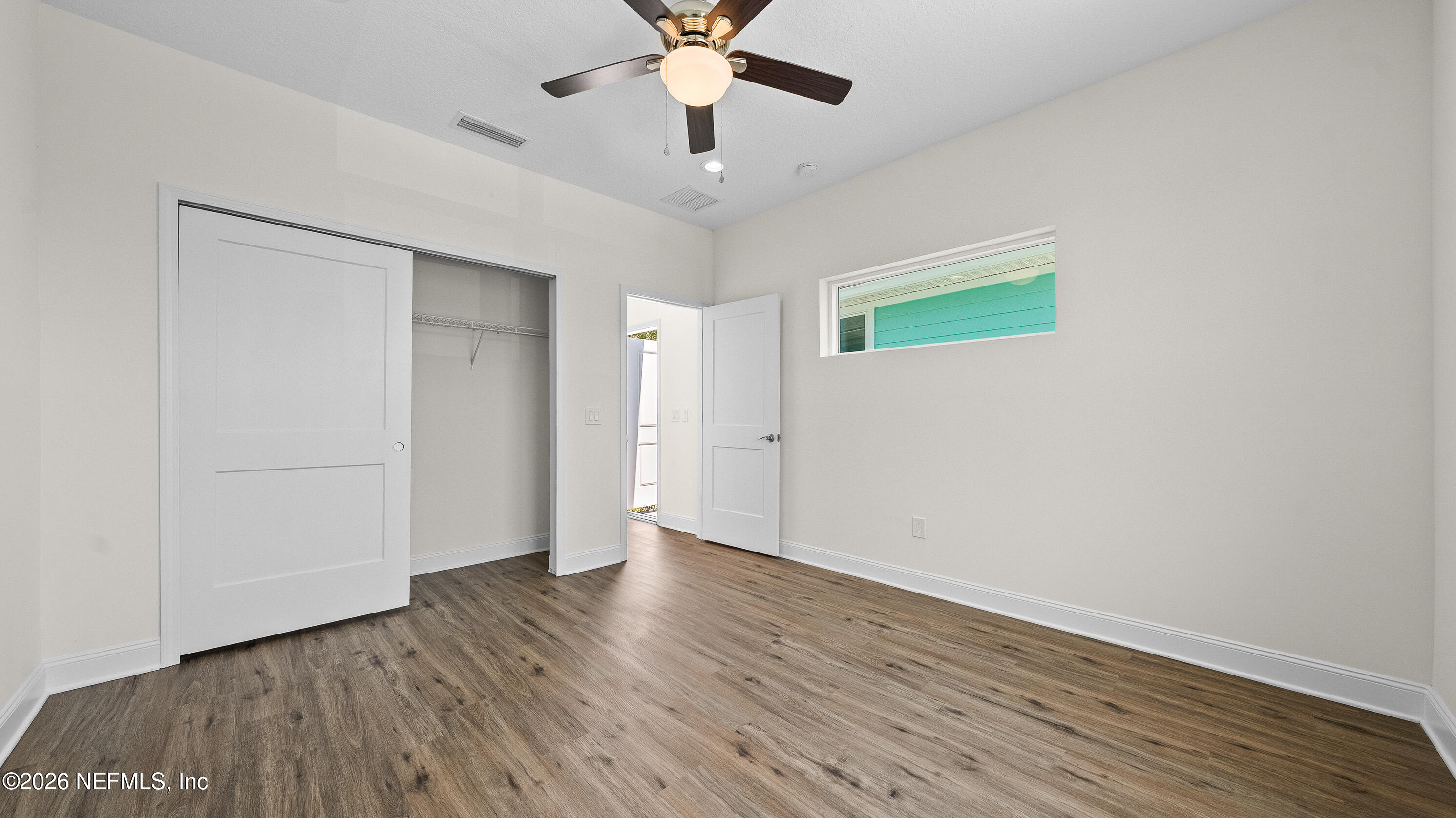 80 Seaside Capers Road St. Augustine, FL 32084 - Photo 38 of 44 a view of an empty room with wooden floor