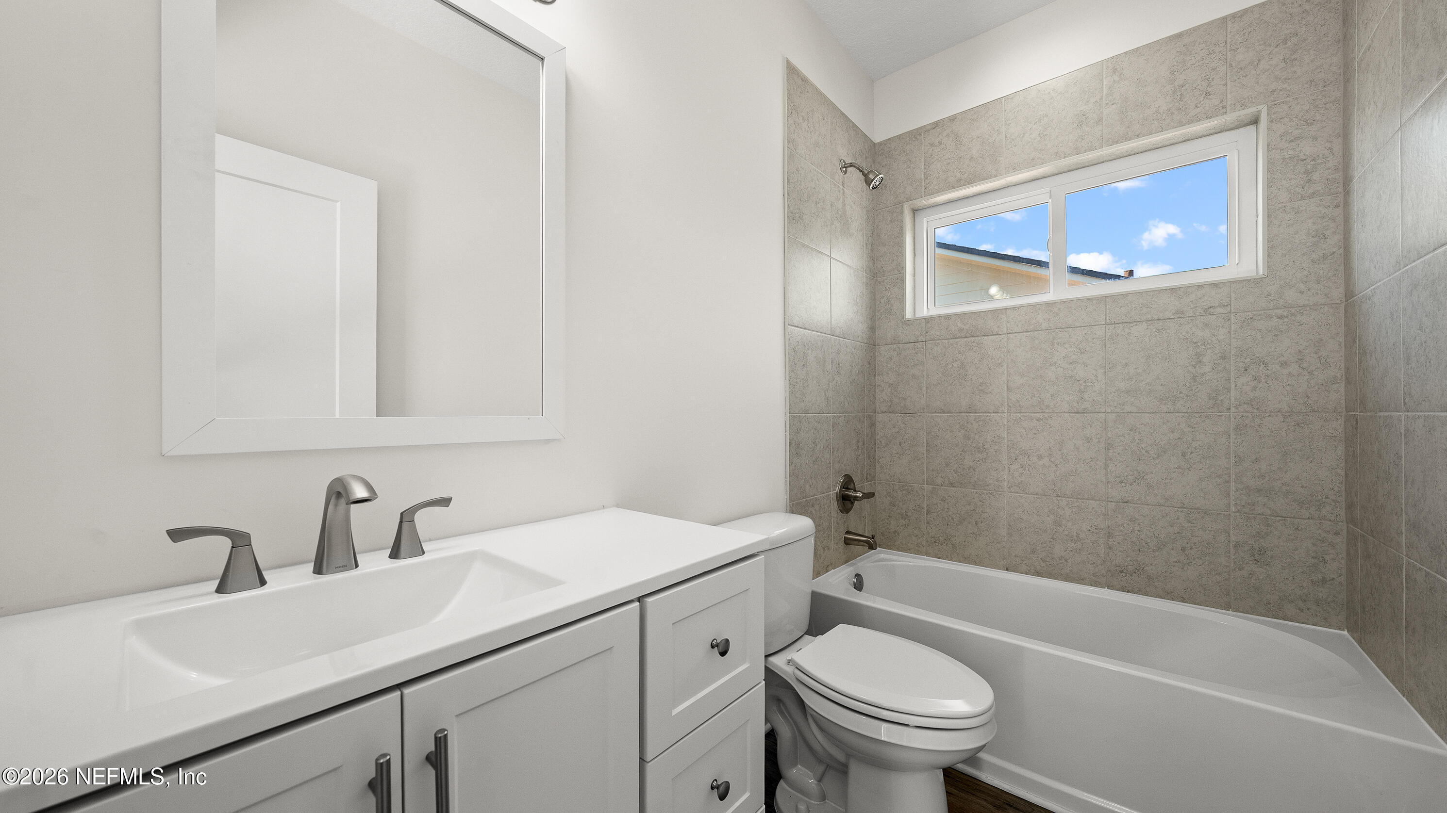 80 Seaside Capers Road St. Augustine, FL 32084 - Photo 40 of 44 a bathroom with a sink a toilet and shower