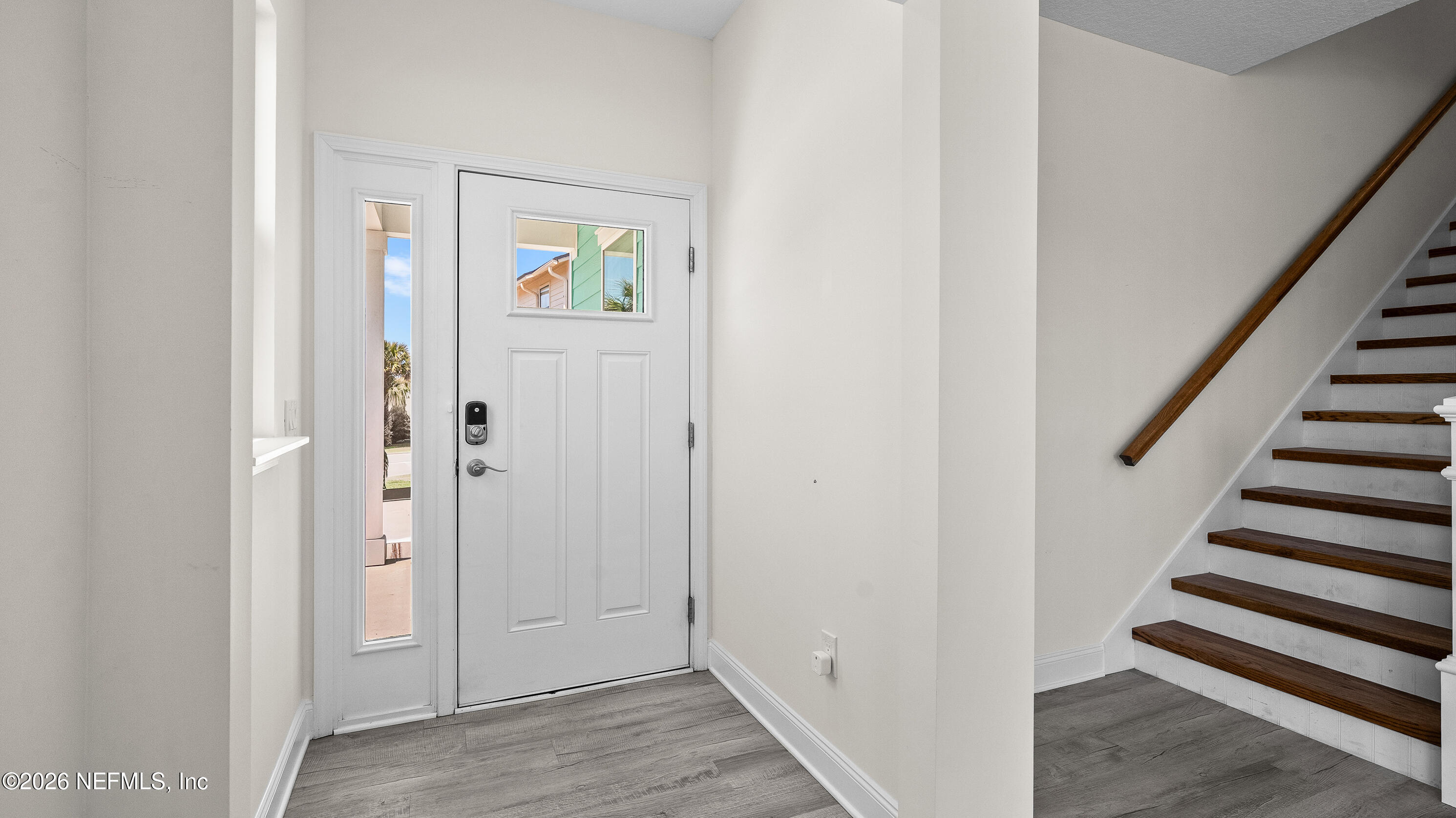 80 Seaside Capers Road St. Augustine, FL 32084 - Photo 4 of 44 a view of an entryway with wooden floor