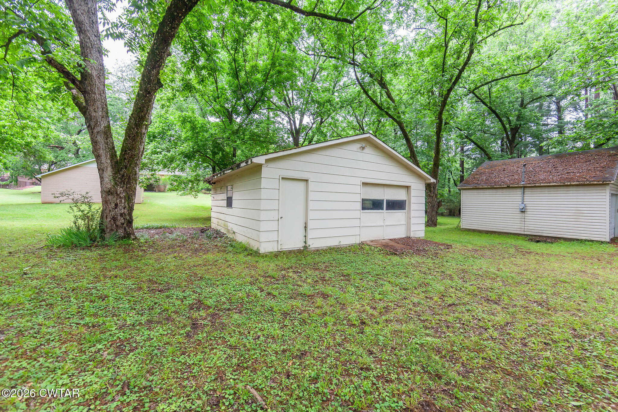 118 Radio Road Jackson, TN 38301 - Photo 20 of 22 a view of a house with a backyard