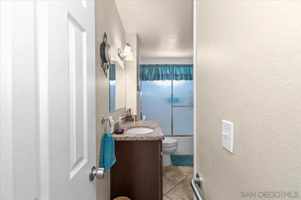 9254 Shadow Hill Road Santee, CA 92071 - Photo 20 of 34 a bathroom with a sink and a mirror