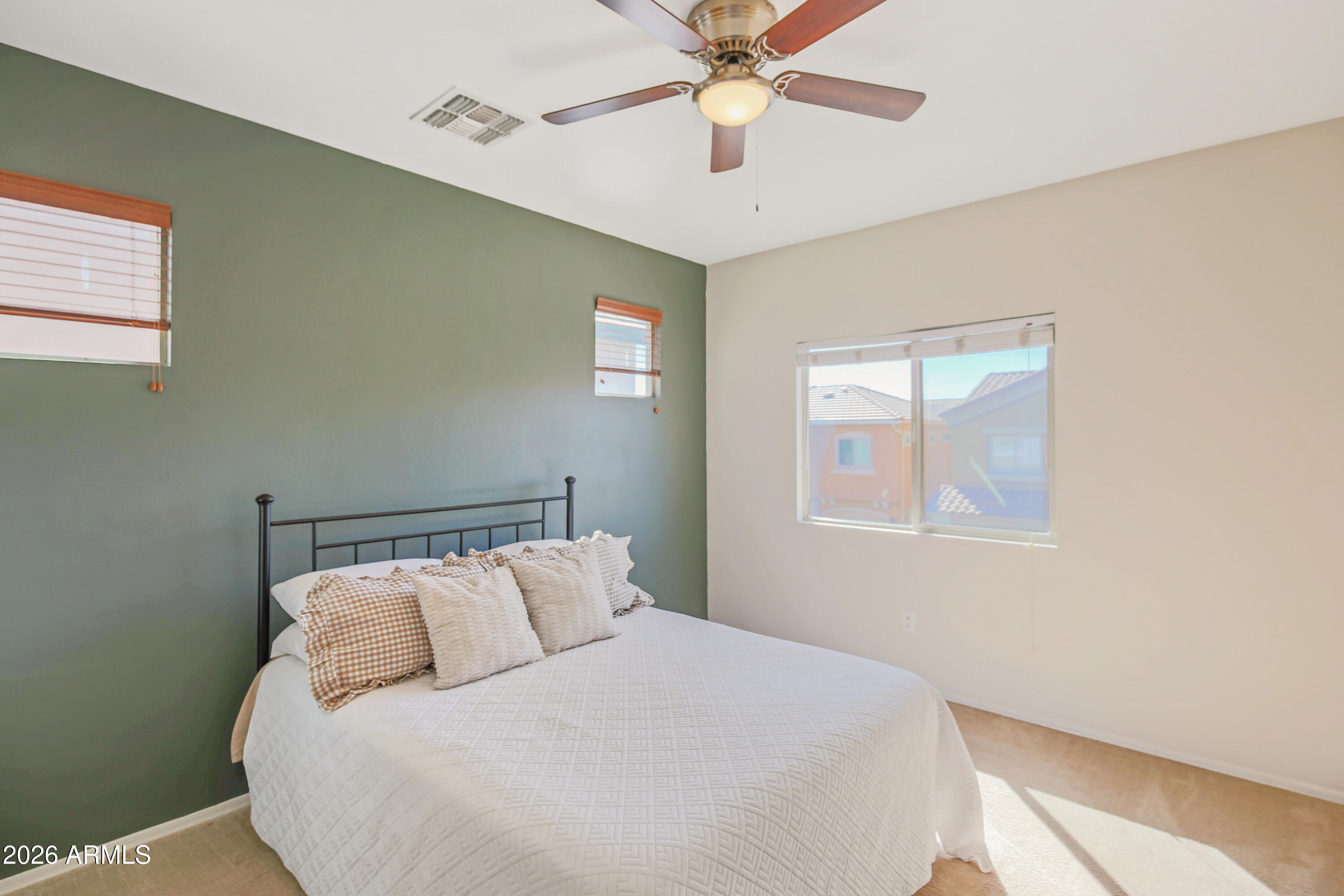 323 South Travis Mesa, AZ 85208 - Photo 11 of 30 a bedroom with a bed and a chandelier