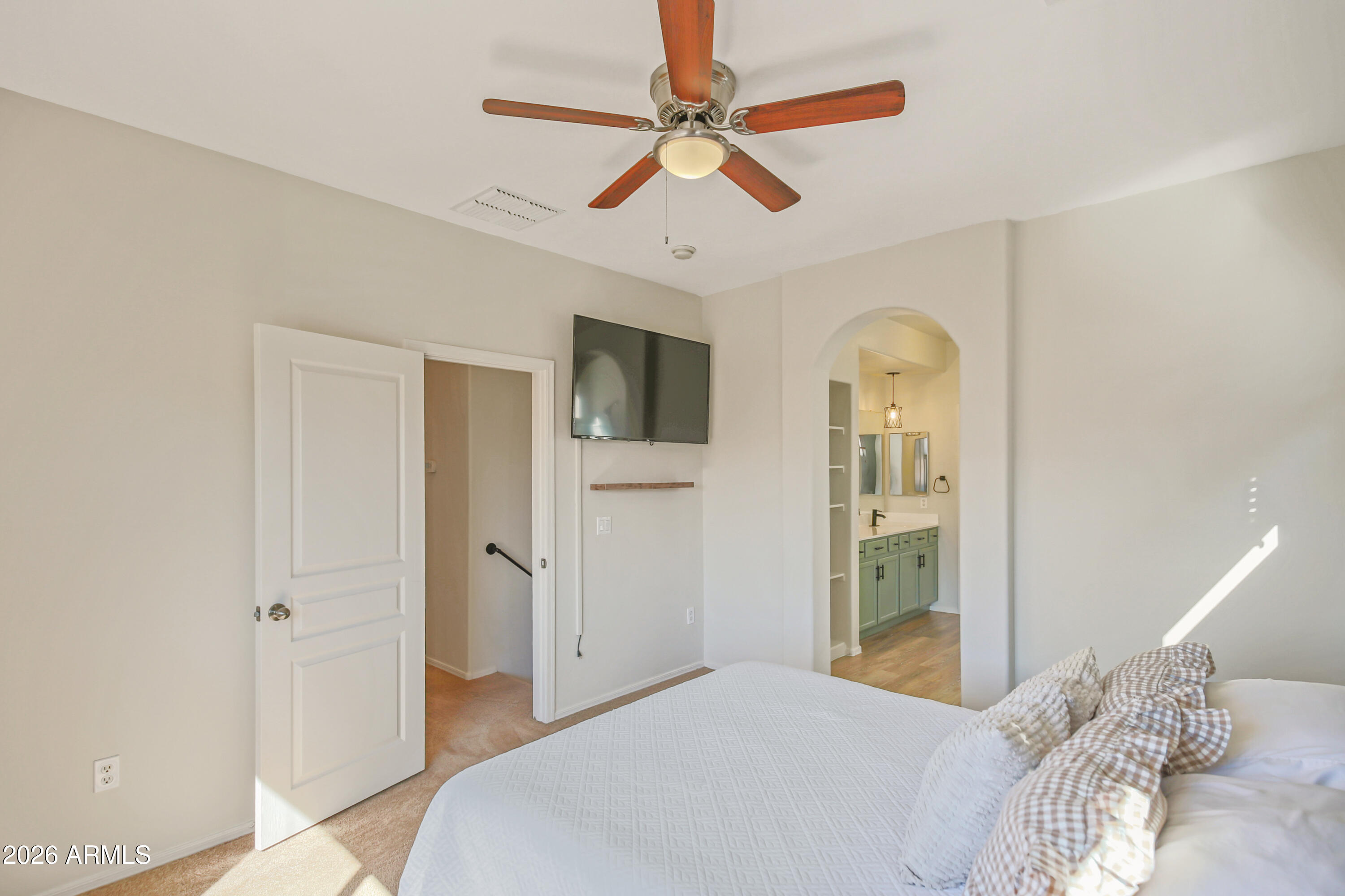323 South Travis Mesa, AZ 85208 - Photo 12 of 30 a bedroom with a bed and a chandelier