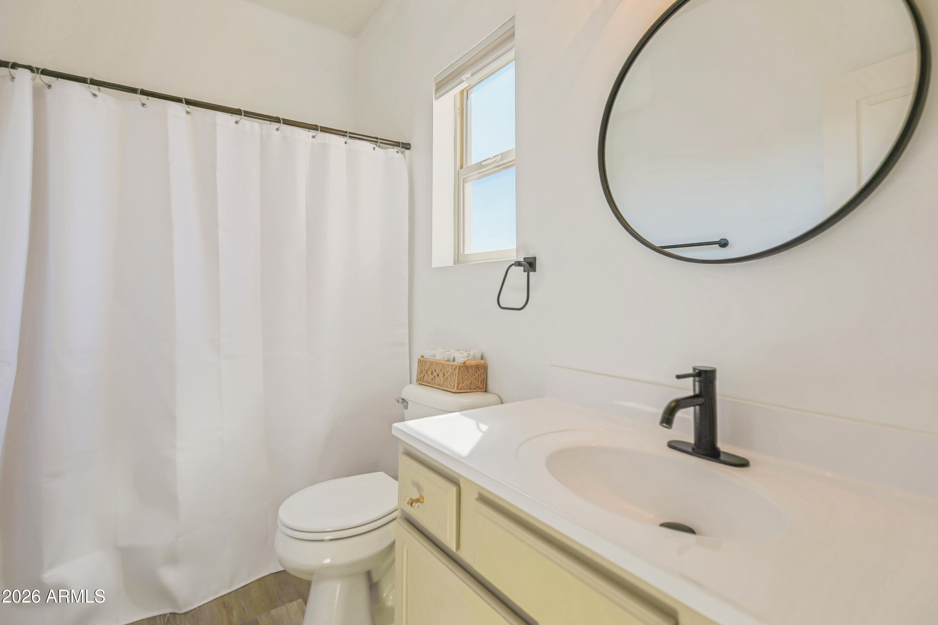 323 South Travis Mesa, AZ 85208 - Photo 19 of 30 a bathroom with a sink a toilet and a mirror
