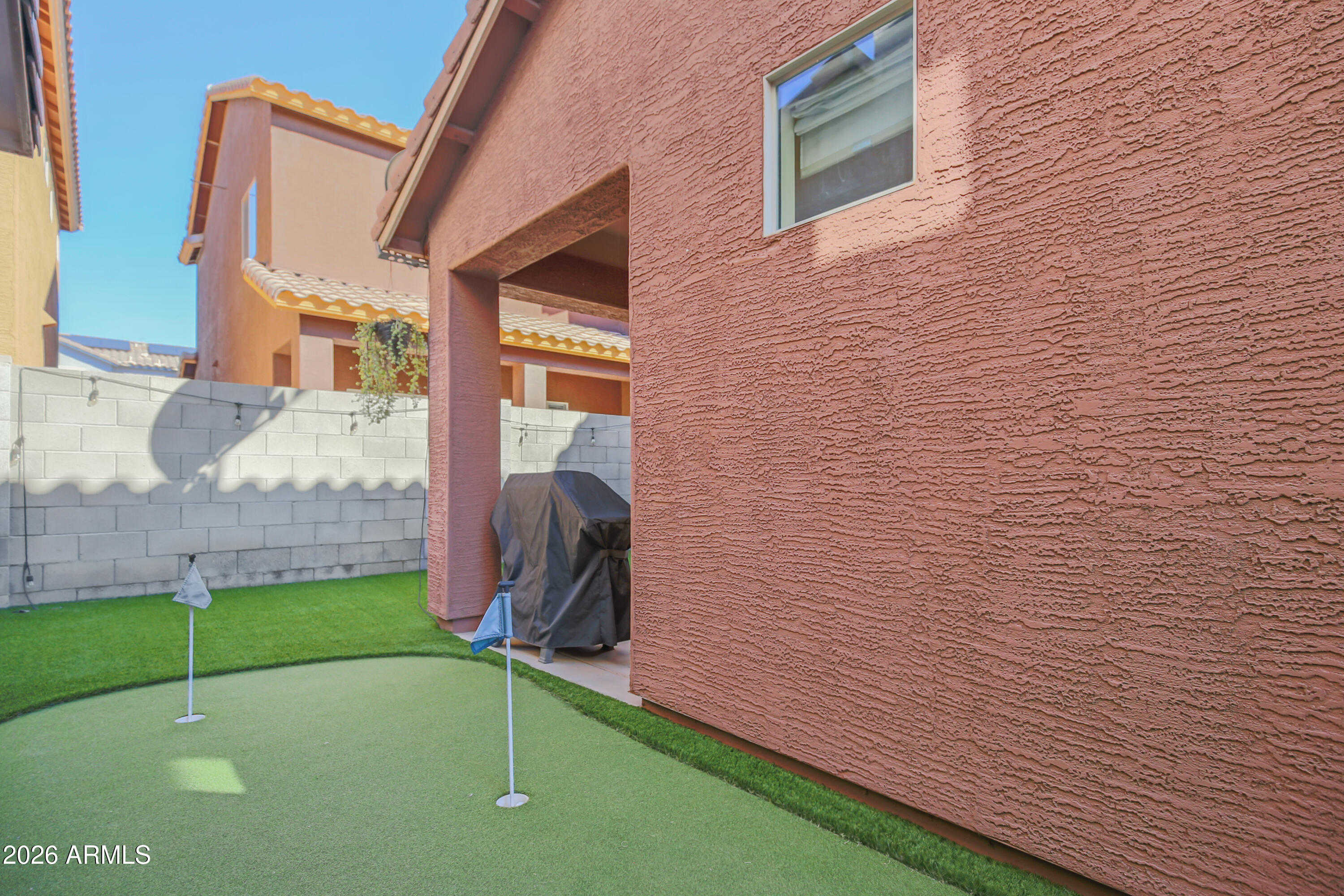 323 South Travis Mesa, AZ 85208 - Photo 22 of 30 a backyard of a house with lots of green space