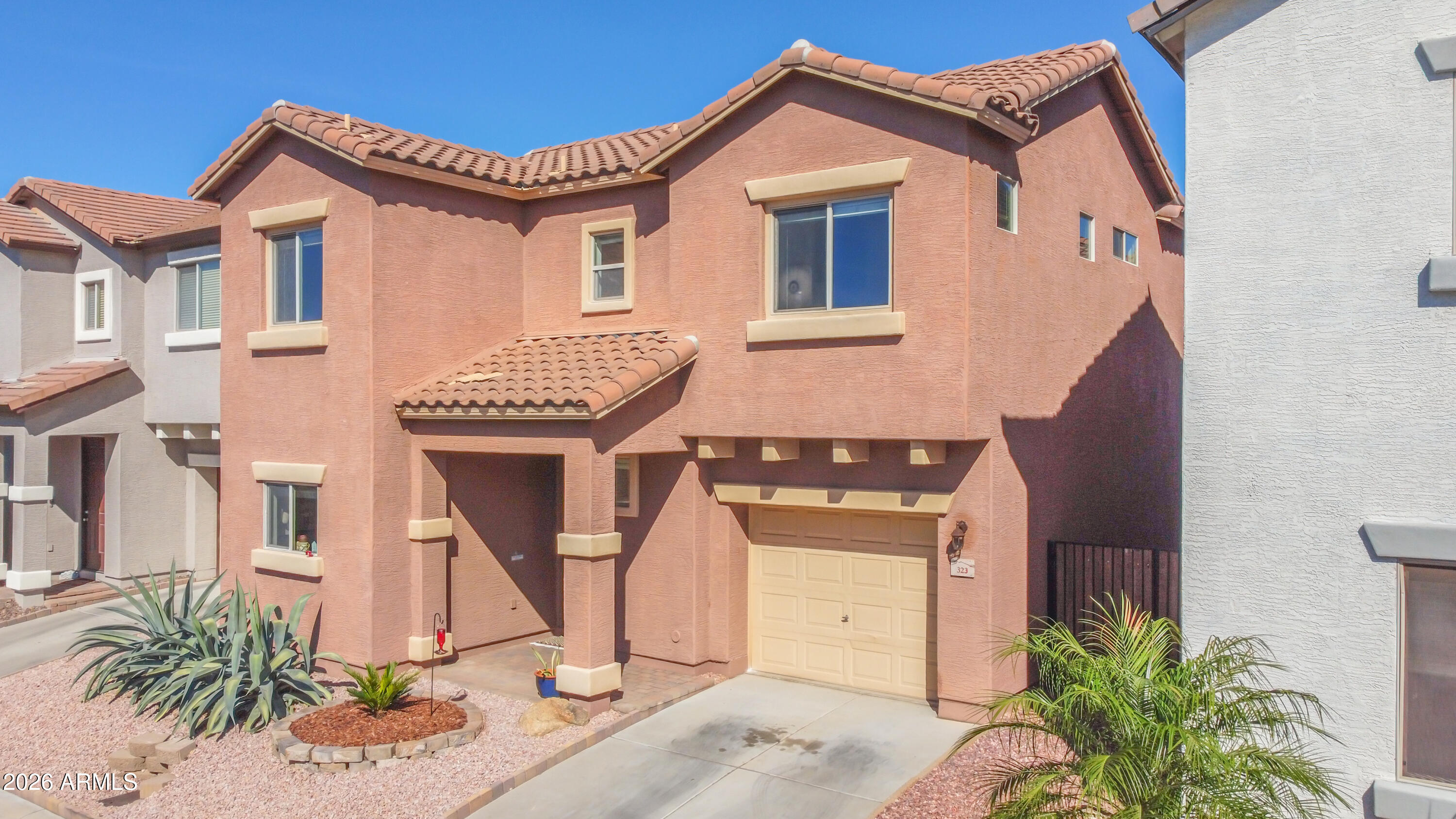 323 South Travis Mesa, AZ 85208 - Photo 28 of 30 a front view of a house with garden