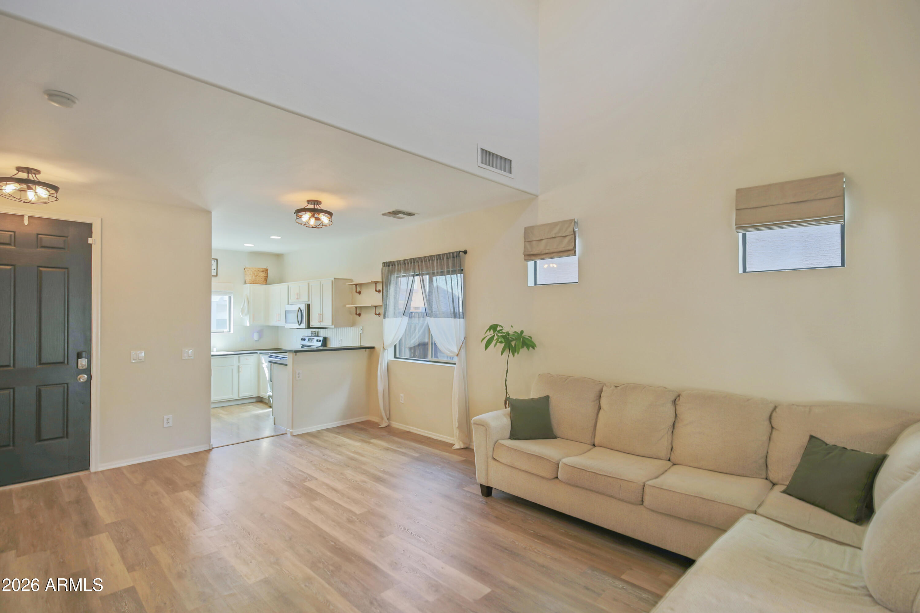 323 South Travis Mesa, AZ 85208 - Photo 4 of 30 a living room with furniture and kitchen view
