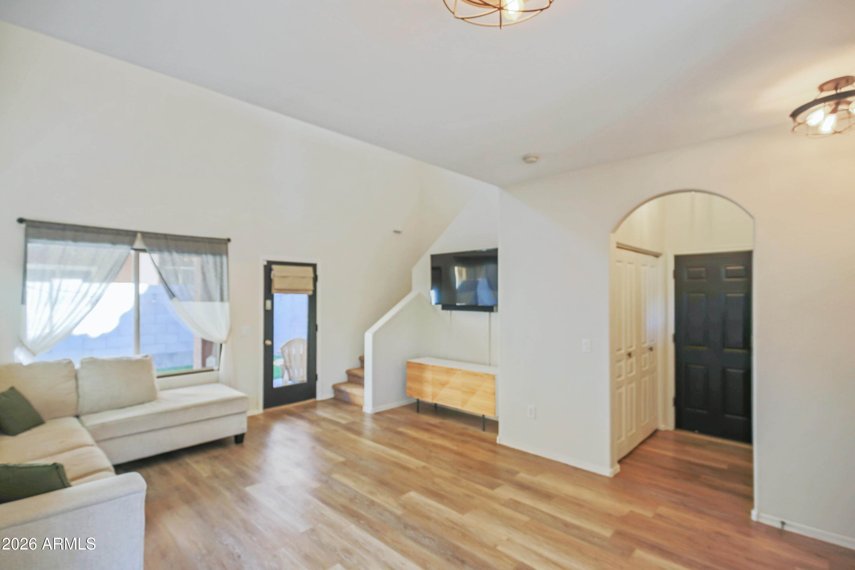 323 South Travis Mesa, AZ 85208 - Photo 6 of 30 a living room with furniture and a wooden floor
