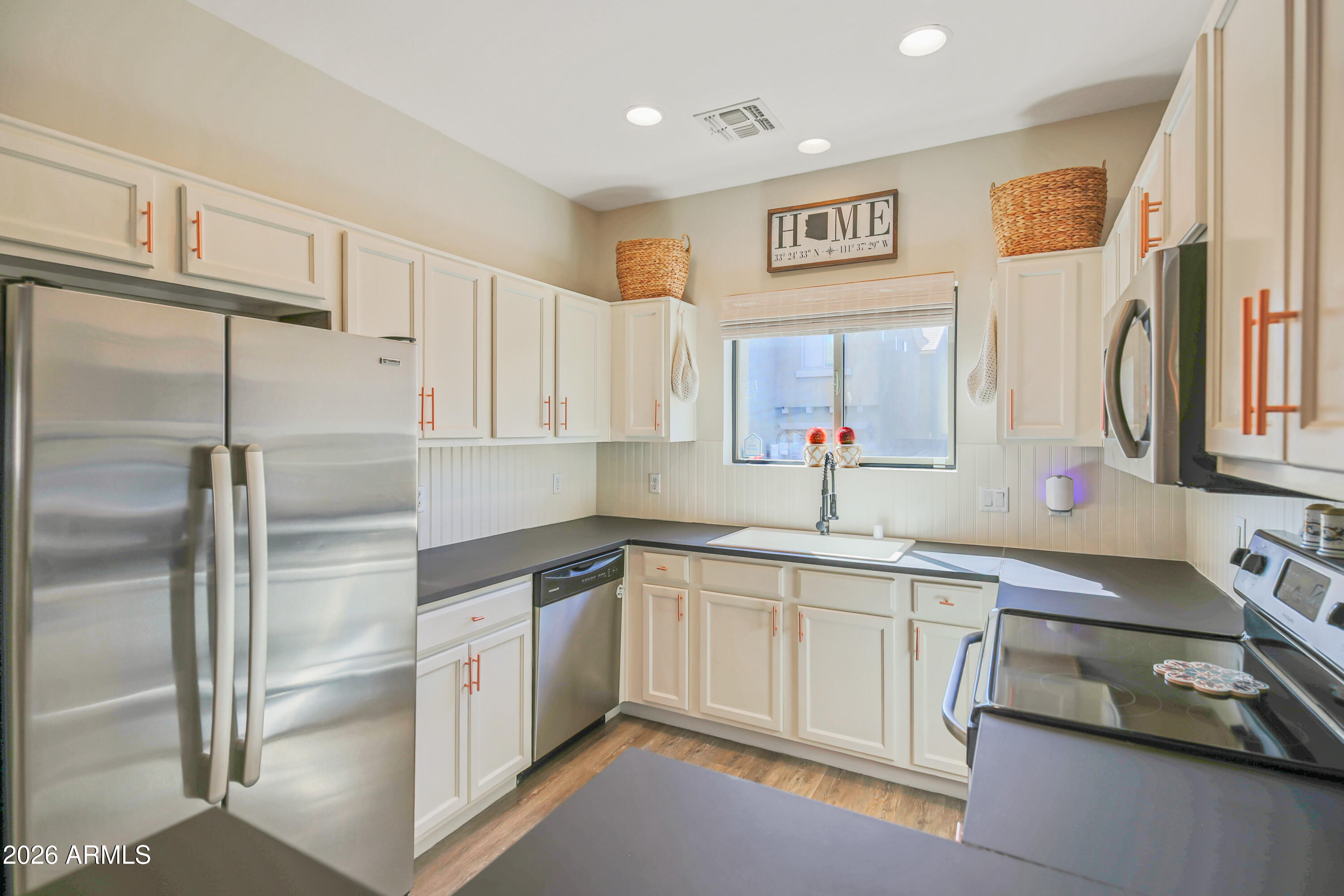 323 South Travis Mesa, AZ 85208 - Photo 7 of 30 a kitchen with stainless steel appliances a refrigerator sink and cabinets