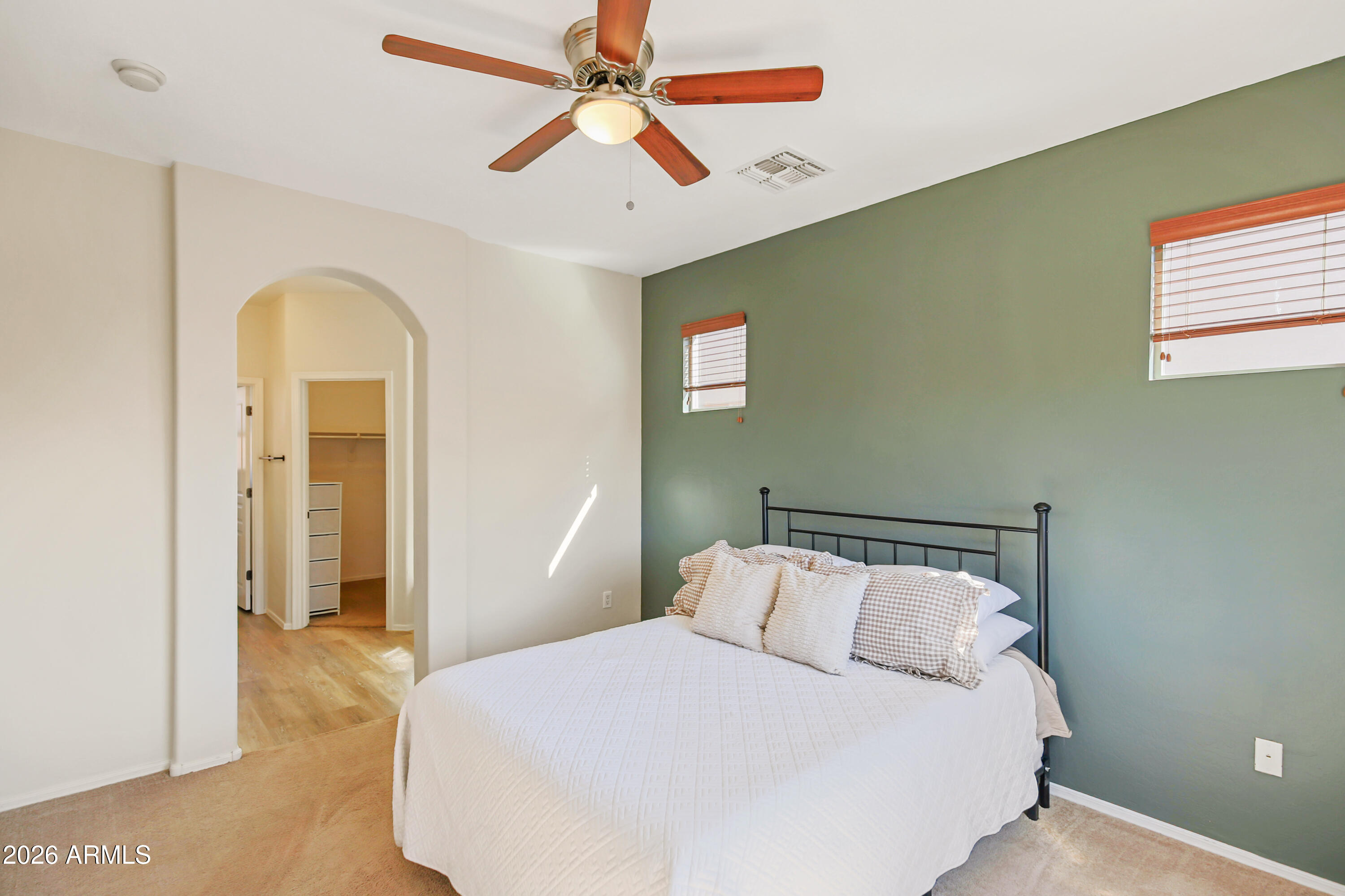 323 South Travis Mesa, AZ 85208 - Photo 10 of 30 a bedroom with a bed and a chandelier