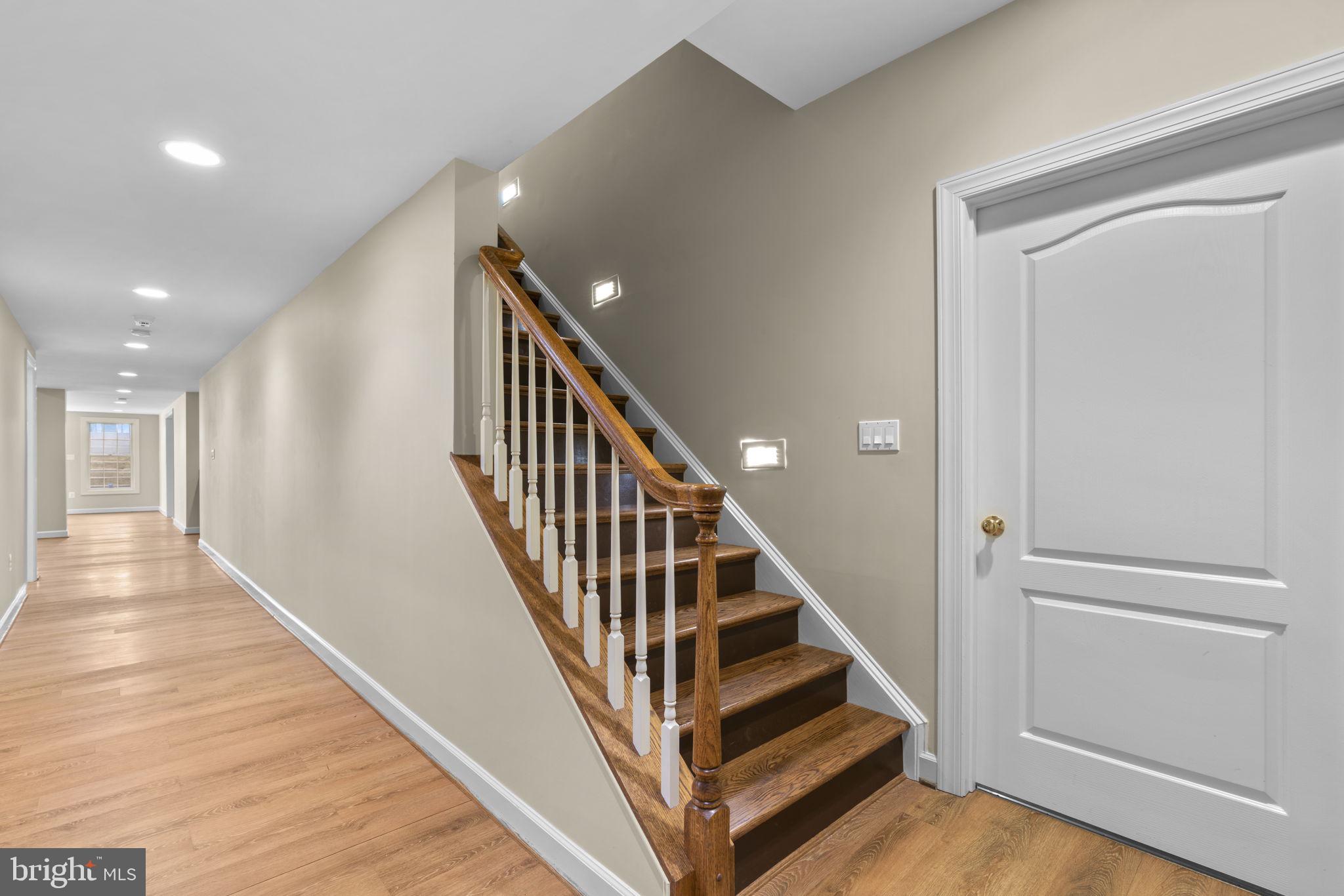 3091 Emerald Valley Road Ellicott City, MD 21042 - Photo 59 of 95 a view of a hallway with wooden floor and entryway