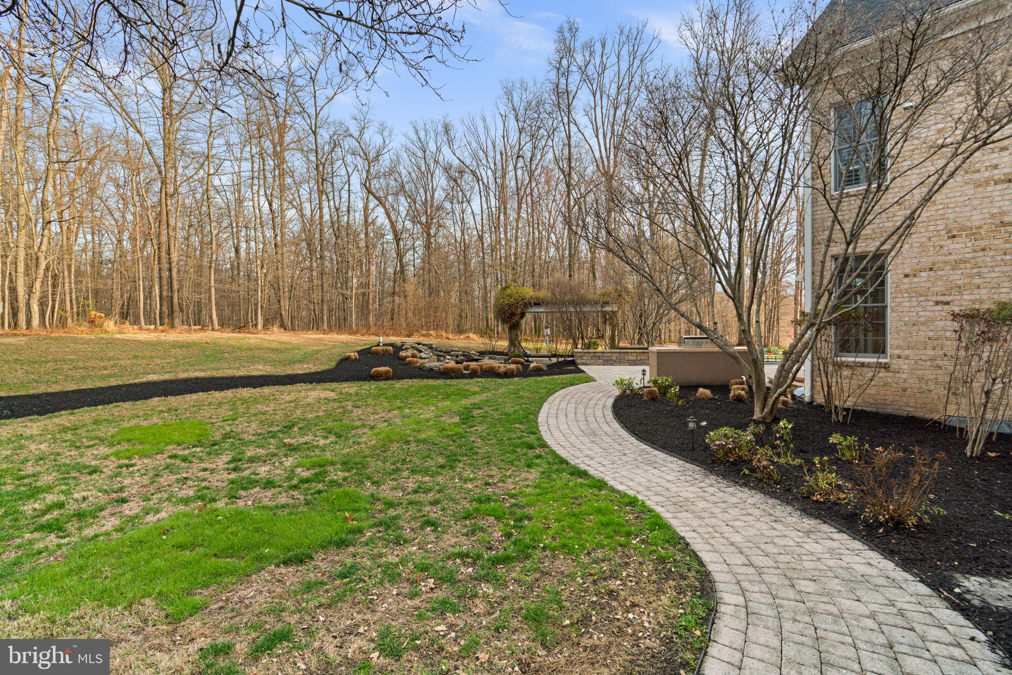 3091 Emerald Valley Road Ellicott City, MD 21042 - Photo 74 of 95 a view of a backyard with large trees