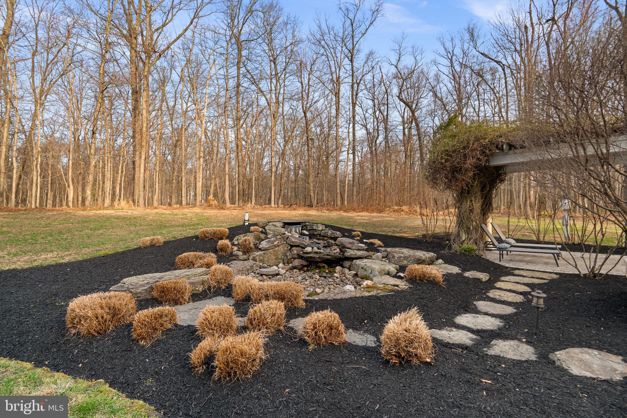 3091 Emerald Valley Road Ellicott City, MD 21042 - Photo 75 of 95 a view of a bench in middle of forest