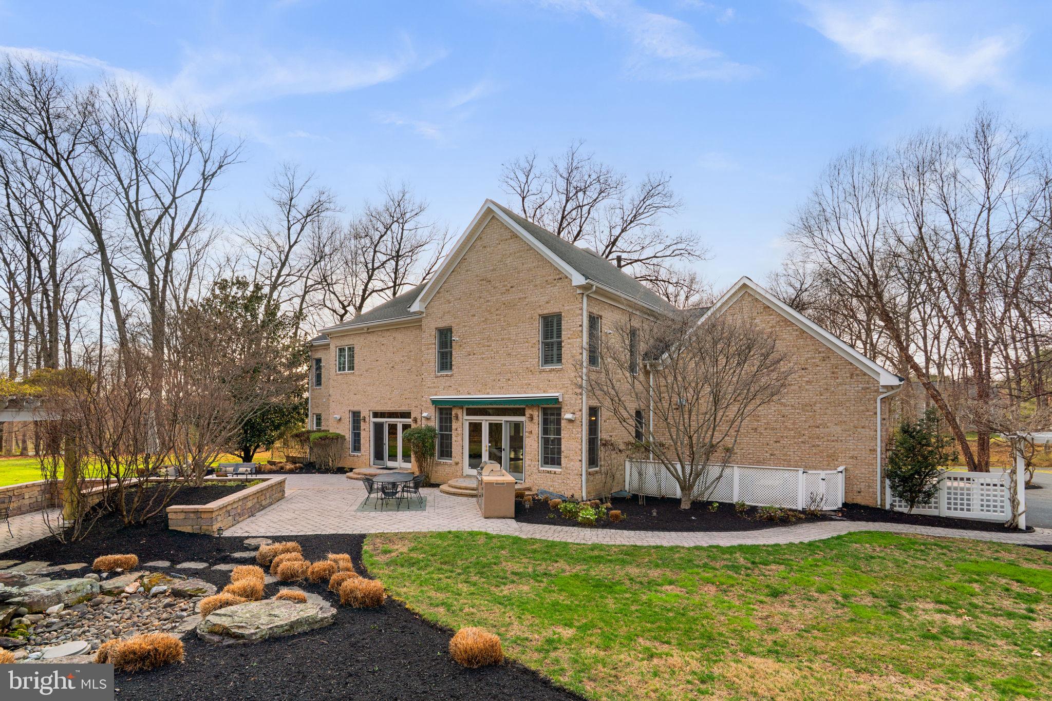 3091 Emerald Valley Road Ellicott City, MD 21042 - Photo 76 of 95 a front view of a house with a yard and garage