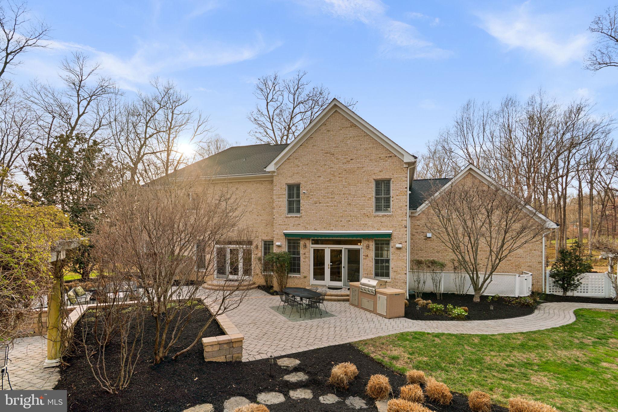 3091 Emerald Valley Road Ellicott City, MD 21042 - Photo 77 of 95 a front view of a house with garden and trees