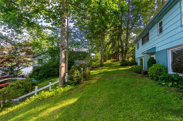 a view of a street with a yard