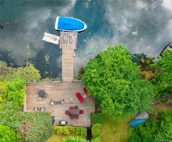 a view of a wooden deck and lake