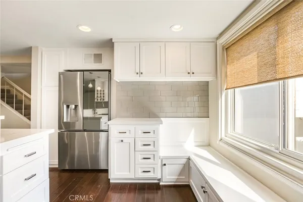 a kitchen with a stove and a microwave