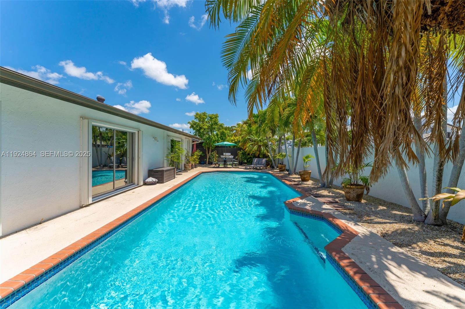 10020 Southwest 145th Place Miami, FL 33186 - Photo 11 of 35 a view of yard with swimming pool