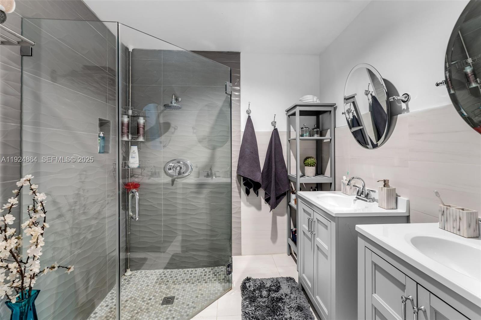 10020 Southwest 145th Place Miami, FL 33186 - Photo 16 of 35 a bathroom with a sink and a mirror