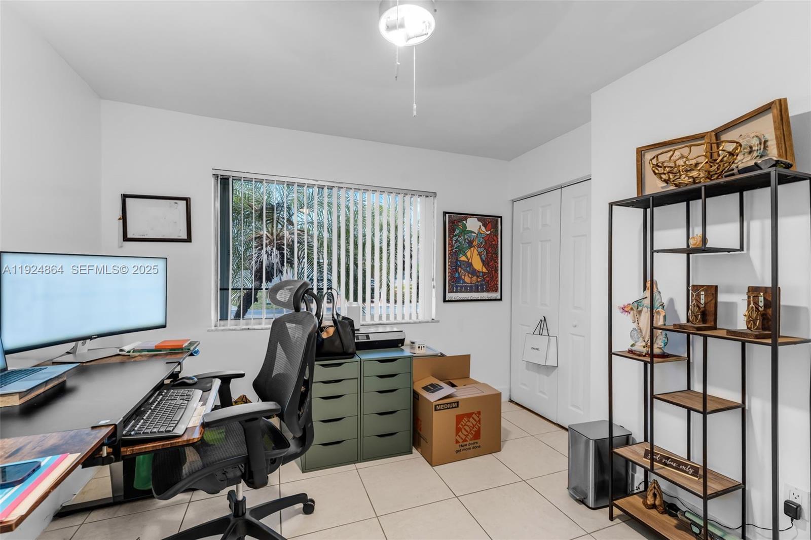 10020 Southwest 145th Place Miami, FL 33186 - Photo 21 of 35 a room with furniture a air conditioner and a window