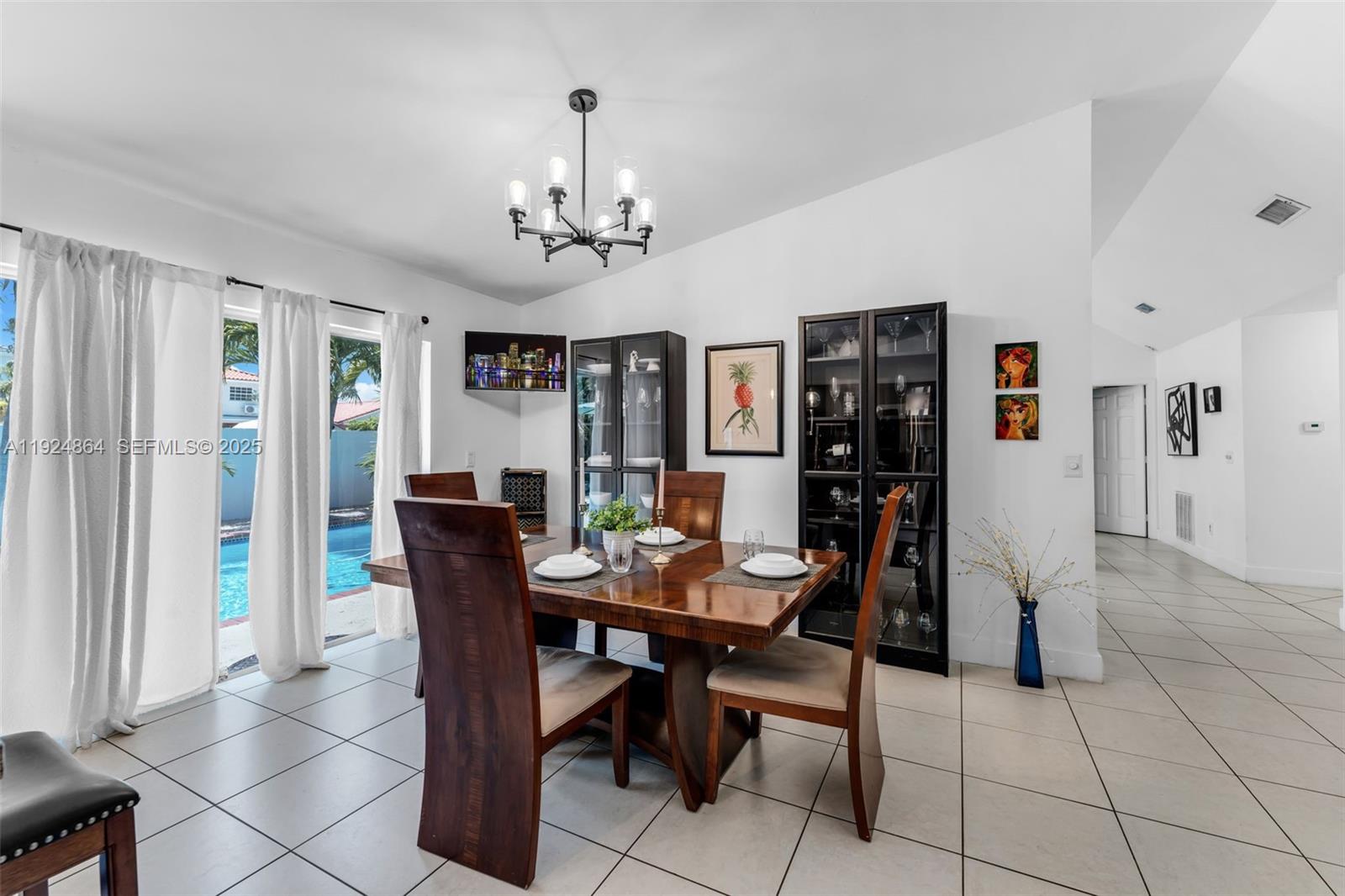 10020 Southwest 145th Place Miami, FL 33186 - Photo 26 of 35 a view of a dining room with furniture