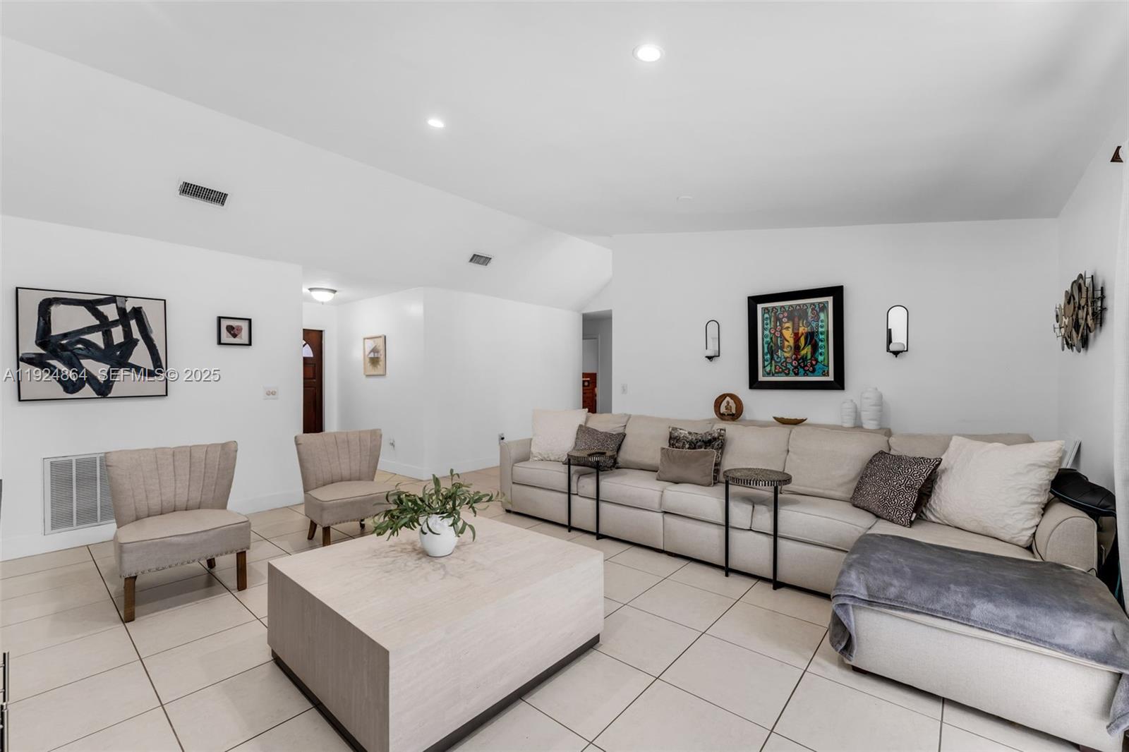 10020 Southwest 145th Place Miami, FL 33186 - Photo 32 of 35 a living room with furniture and a couch