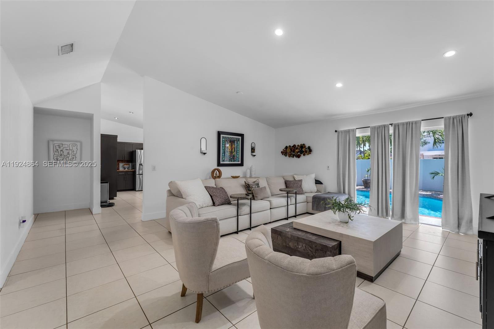 10020 Southwest 145th Place Miami, FL 33186 - Photo 33 of 35 a living room with furniture and wooden floor
