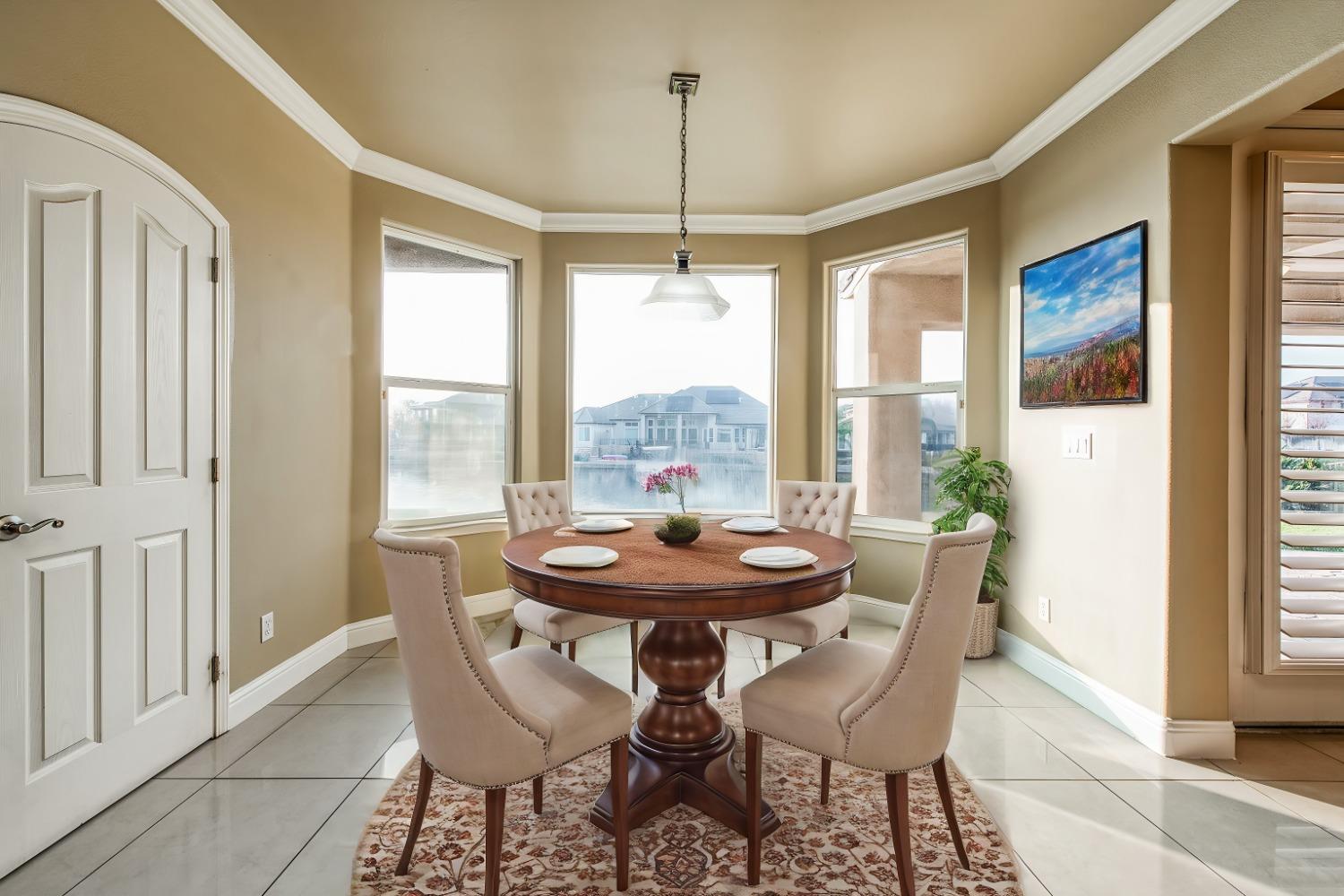 4679 North Island View Clovis, CA 93619 - Photo 13 of 55 a dining room with furniture and window