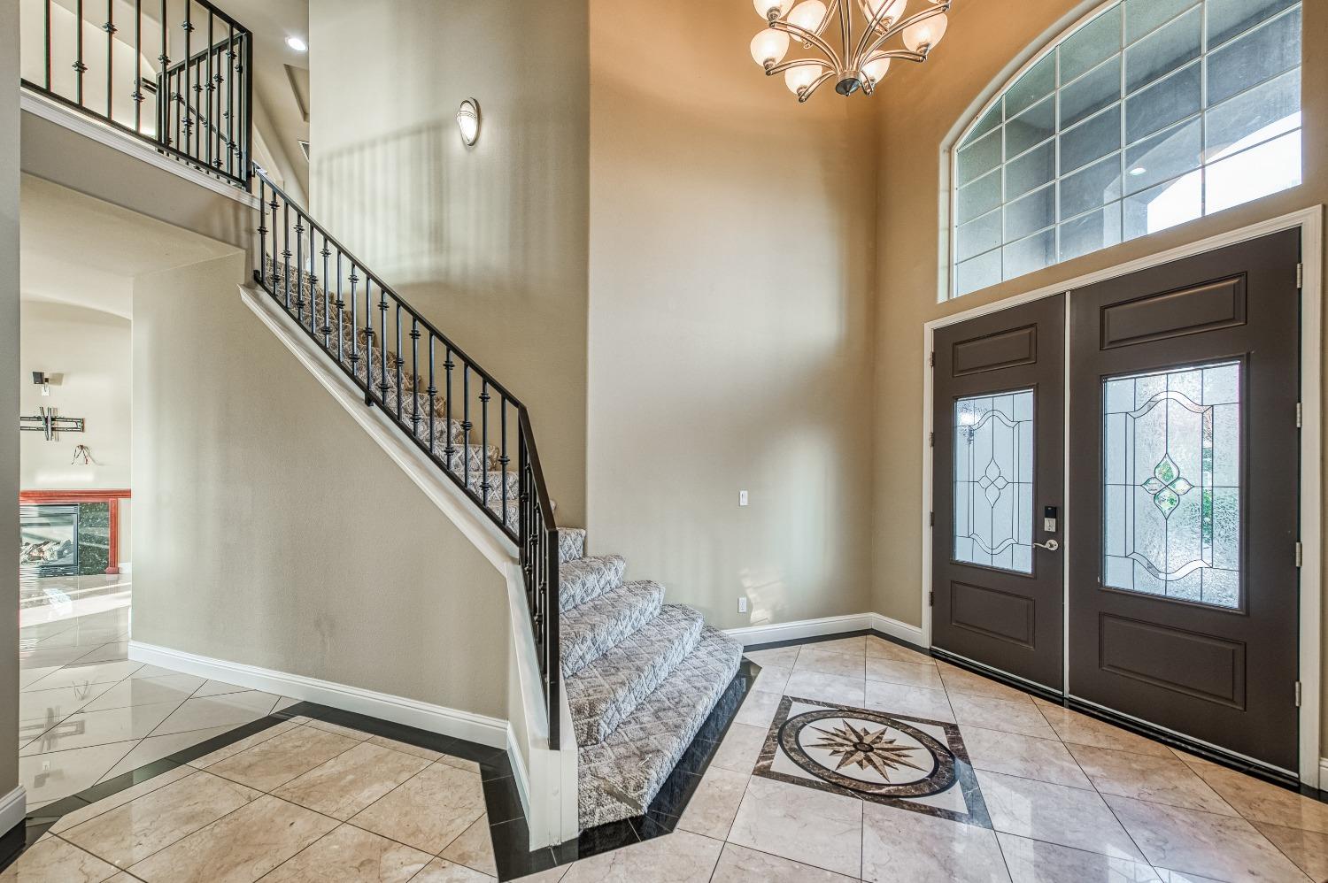 4679 North Island View Clovis, CA 93619 - Photo 16 of 55 a view of entryway and hall with wooden floor