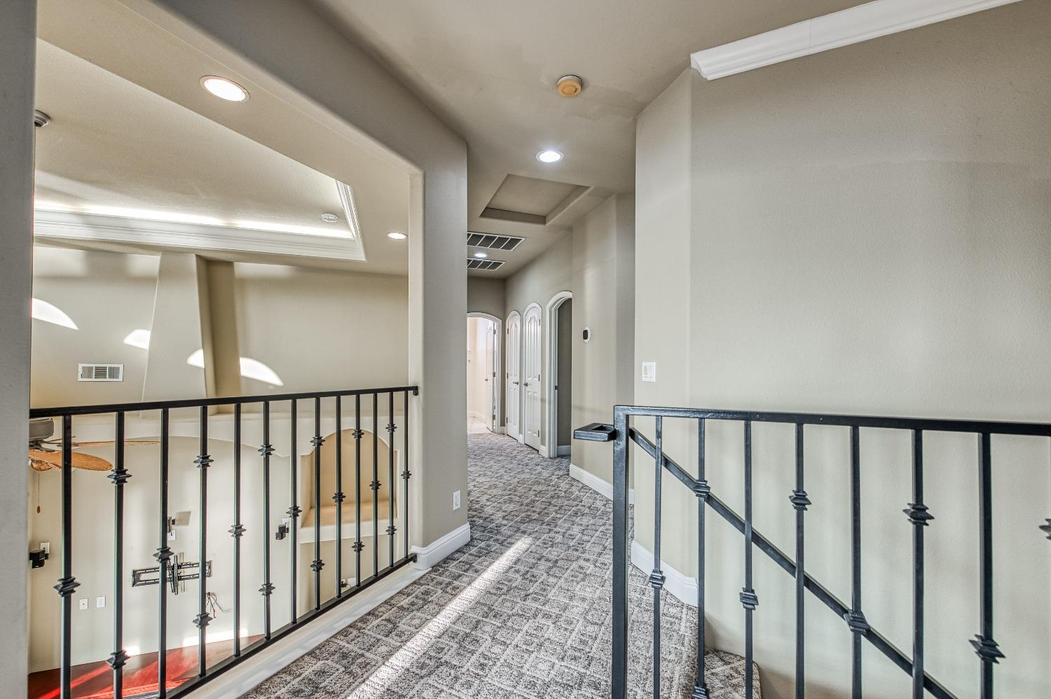 4679 North Island View Clovis, CA 93619 - Photo 17 of 55 a view of staircase with rug floor