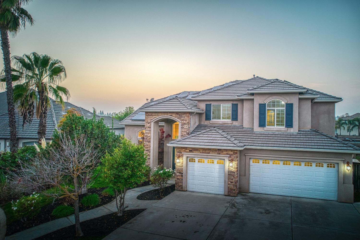 4679 North Island View Clovis, CA 93619 - Photo 39 of 55 a front view of a house with a yard