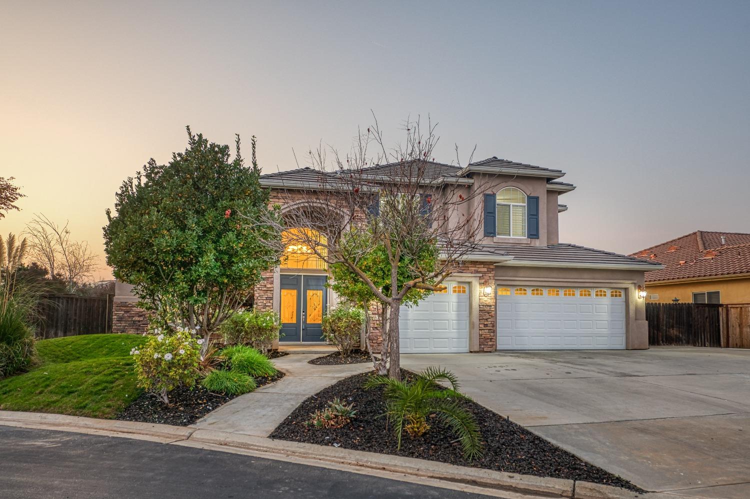 4679 North Island View Clovis, CA 93619 - Photo 5 of 55 a front view of a house with garden