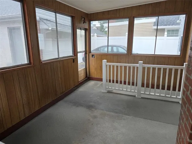 a view of a balcony with wooden floor